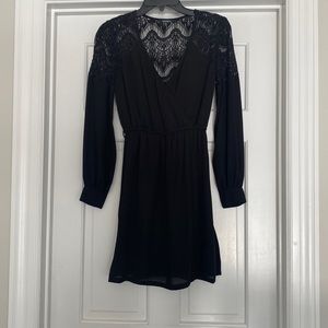 Little black dress. Long sleeve with lace detail on back on shoulders.